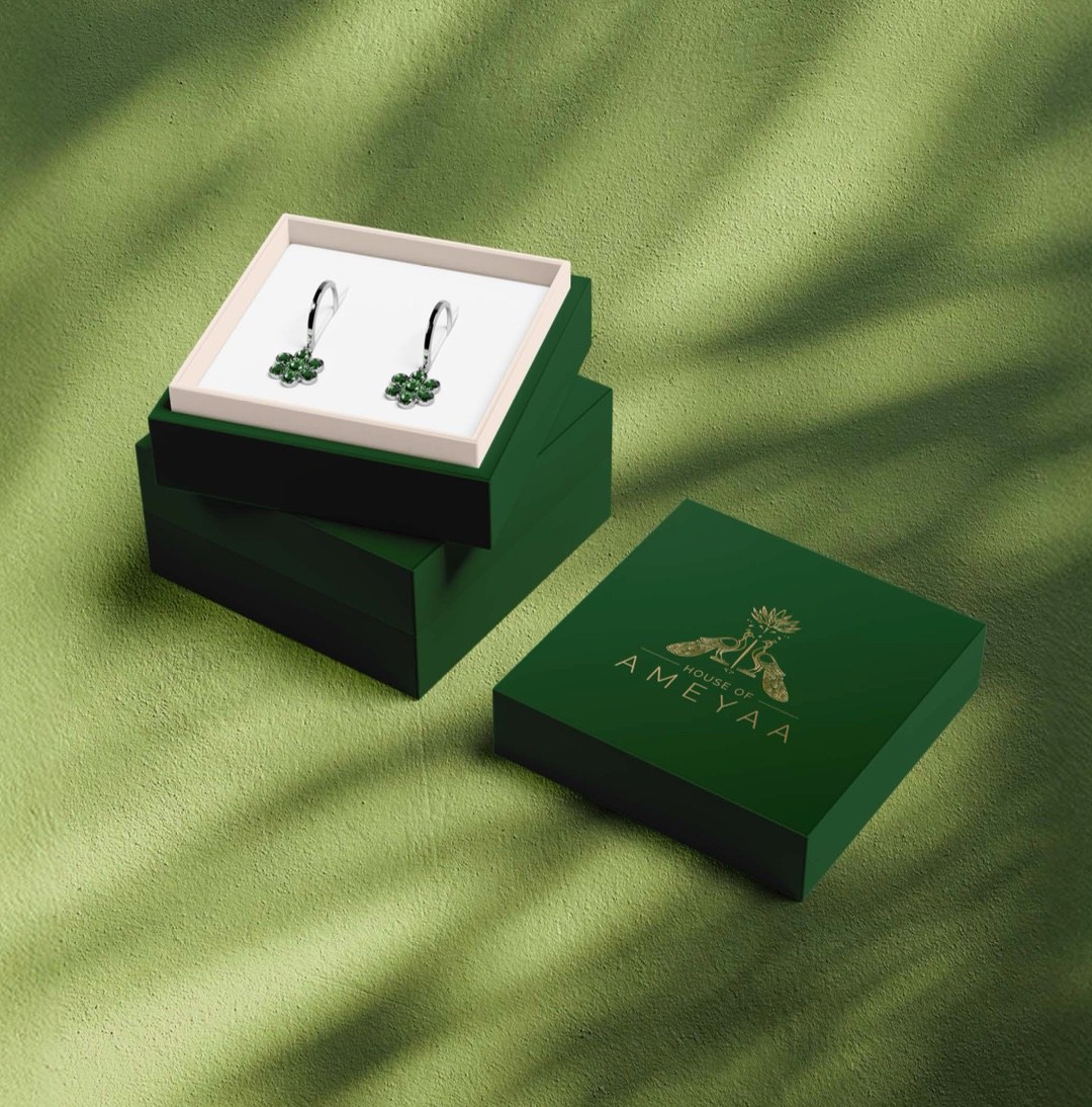 House of Ameyaa — branded forest green gift box with antique gold monogram and emerald drop earrings