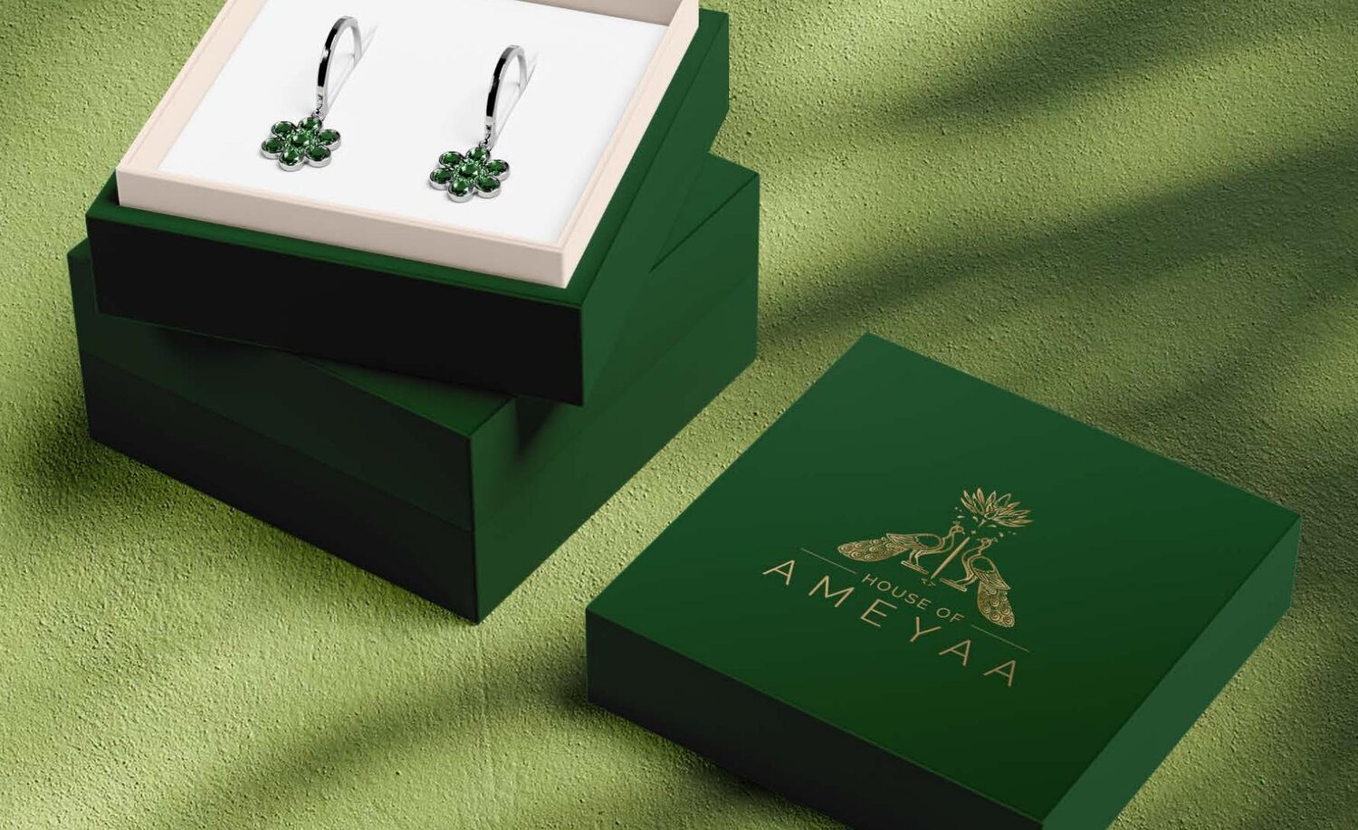 Forest green earring box with antique gold monogram and emerald drops