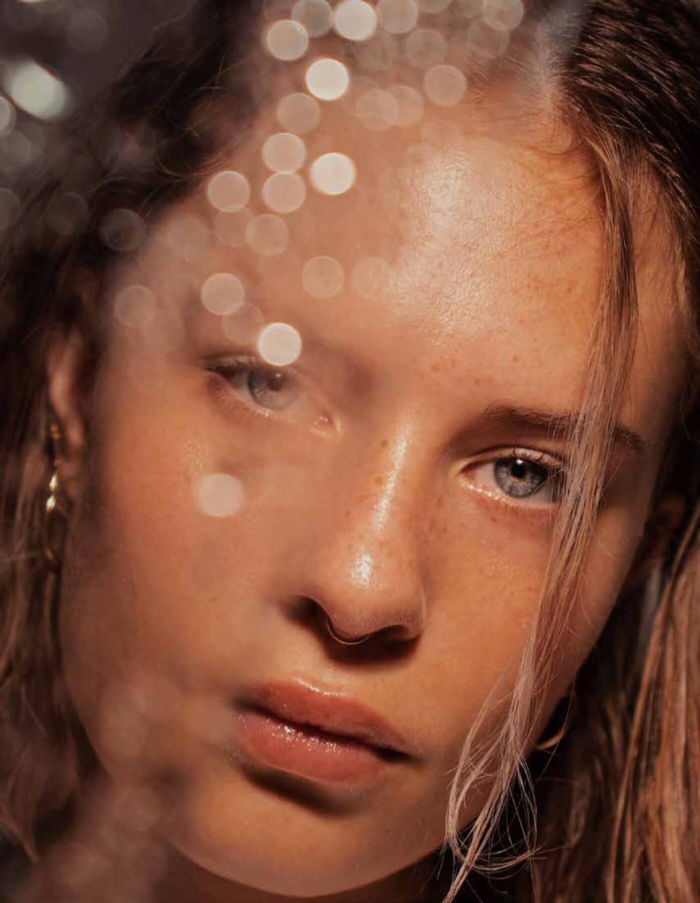 Sun-flecked portrait of a freckled face — Green Lab editorial mood